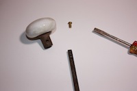 photo of parts of a house door handle assembly