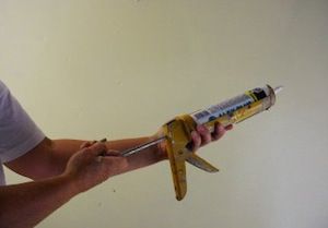 photo demonstrating how to use a caulk gun