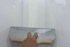 photo floating joint compound over the drywall seam