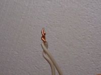 photo of two wires spliced together with a clockwise twist