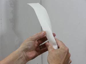 photo folding paper drywall tape along the crease