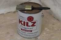 photo of a can of kilz primer and a paint brush