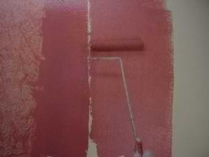 photo demonstrating how to roll painting glaze onto a wall