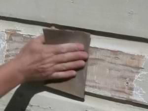 photo demonstration sanding wood after scraping peeling paint