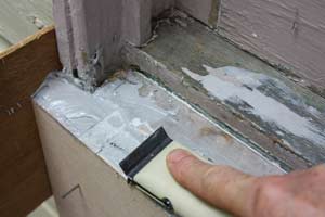 photo shaping hardened epoxy filler in a windowsill