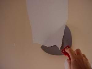 photo removing the backing paper on vinyl wallpaper